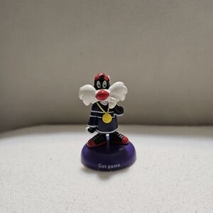 Cartoon Character Figurine with Purple Base